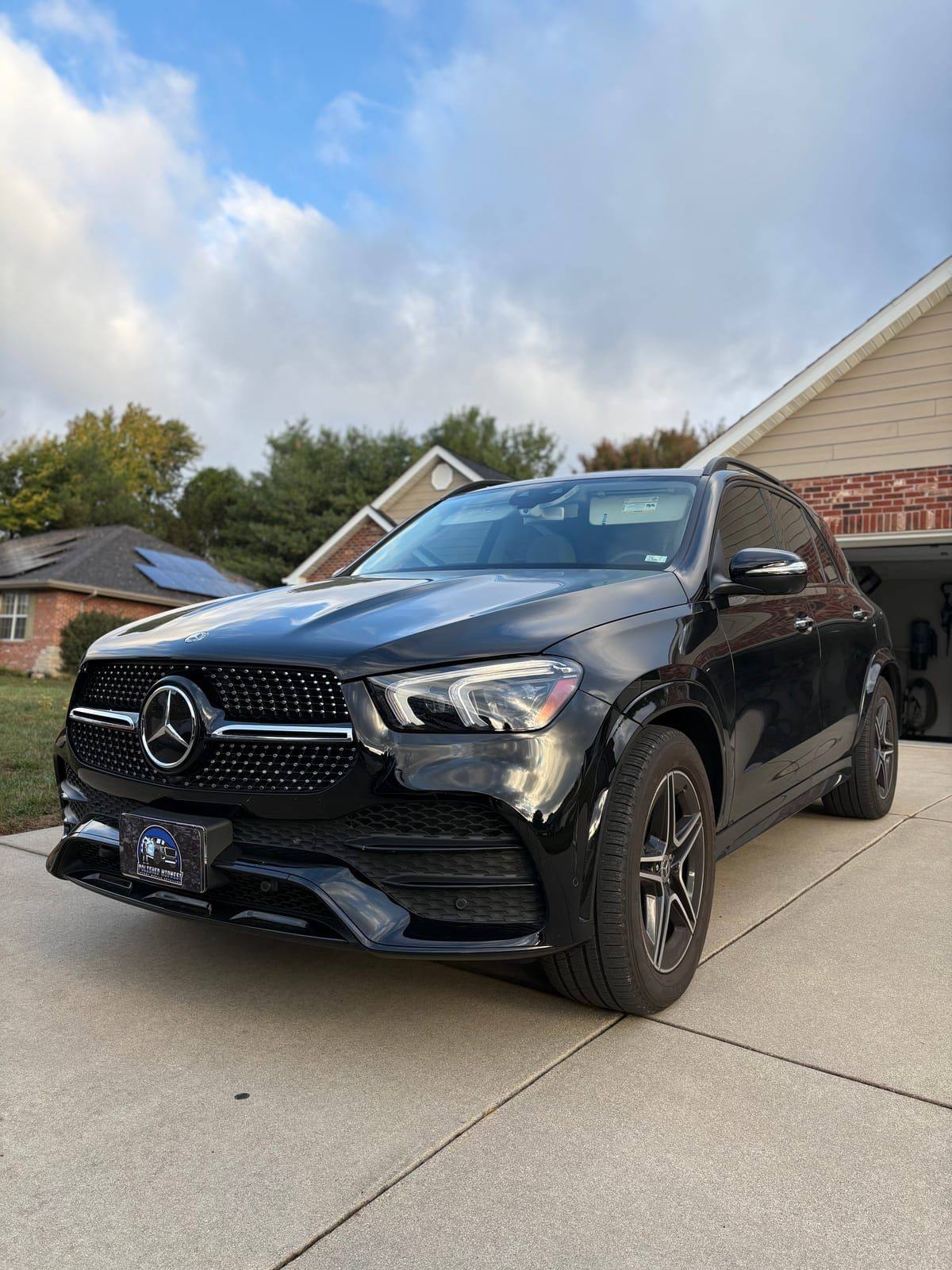 Black Mercedes GLE coupe front view with high gloss finish after detailing