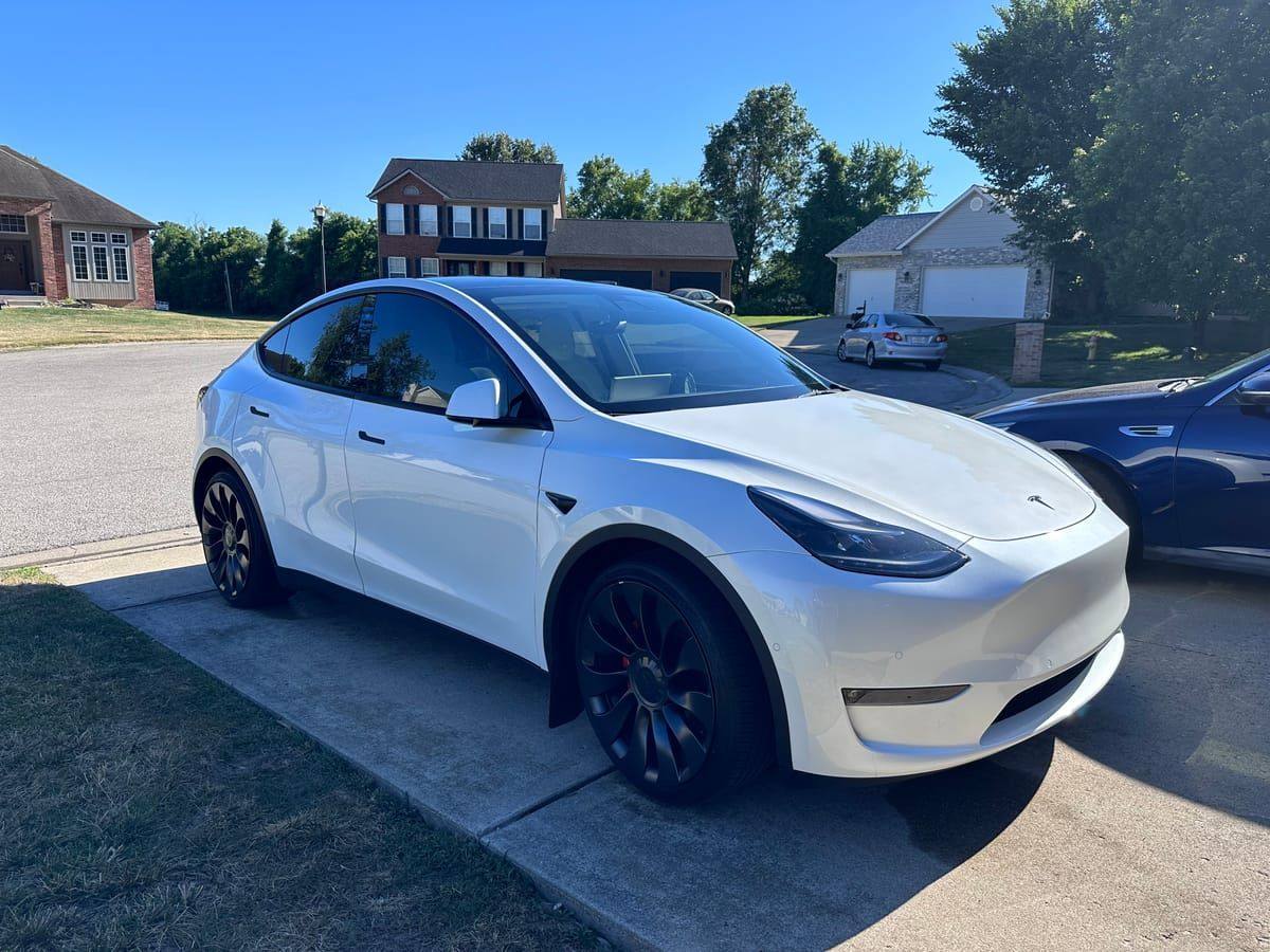 White Tesla Model Y with clean glossy paint after mobile detailing